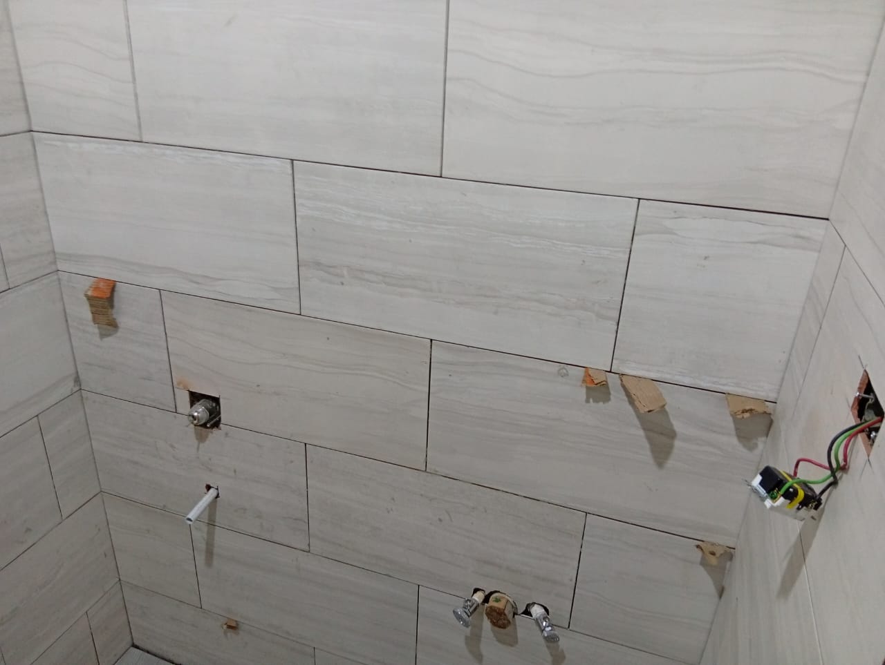 Bathroom wall plumbing rough-in during renovation